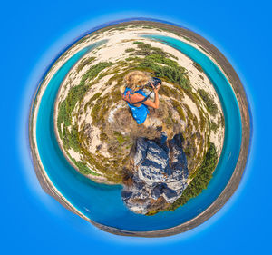 Boy swimming in blue water