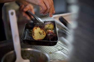 Midsection of man preparing food