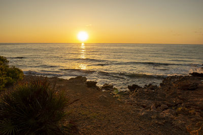 Scenic view of sea against sky during sunset