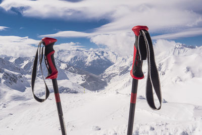 People skiing on snowcapped mountain against sky