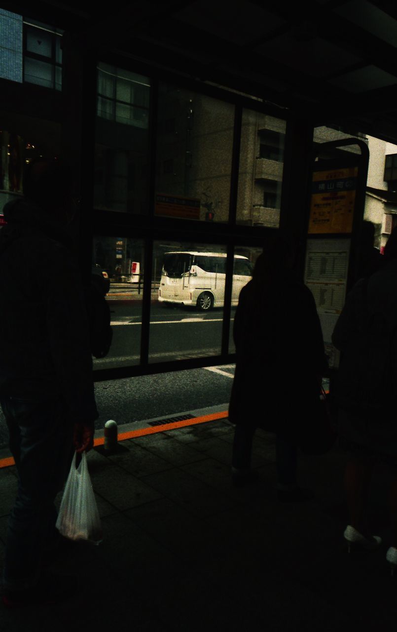 transportation, real people, public transportation, men, railroad station platform, lifestyles, rail transportation, railroad station, train - vehicle, mode of transport, indoors, two people, passenger, waiting, standing, railroad platform, commuter, women, day, only men, adults only, people, adult