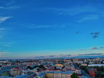 High angle view of townscape against blue sky