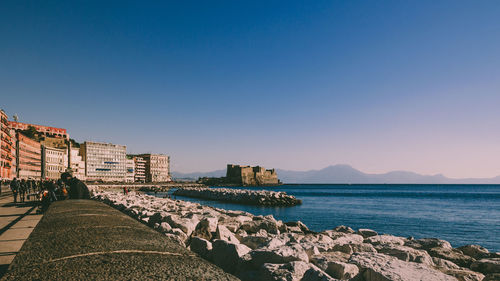 Scenic view of sea against clear blue sky