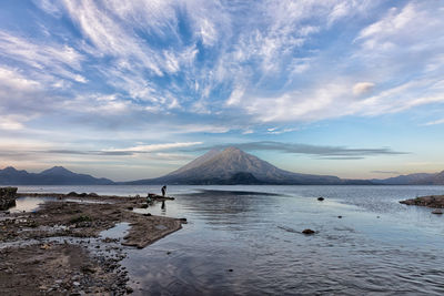 Scenic view of lake and volcano in guatemala.