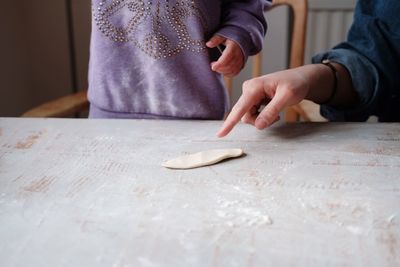 Midsection of woman preparing food