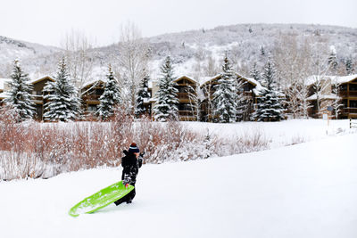 Man skiing on snow covered field