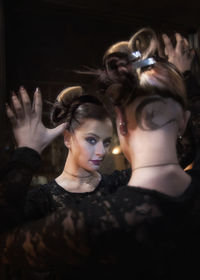 Portrait of young woman with hands