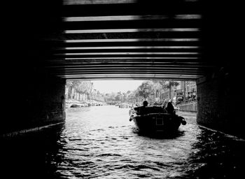 People on boat sailing in river