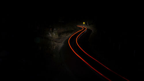 High angle view of light trails on road at night