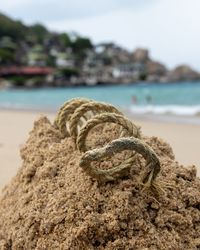 Close-up of rope on beach