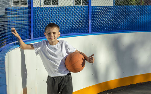 Golden hour glory, boy's basketball passion shines bright in the sunset on the basketball court