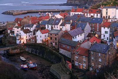 High angle view of townscape by sea