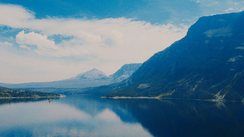 Scenic view of lake against cloudy sky