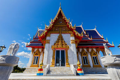 Low angle view of building against blue sky