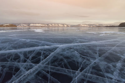 Scenic view of frozen landscape against sky