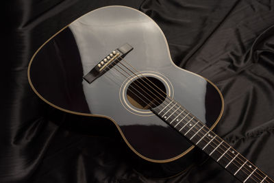 High angle view of guitar playing piano