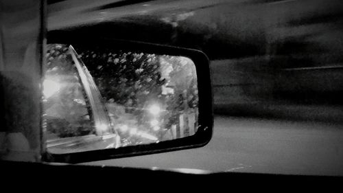 Reflection of car on side-view mirror