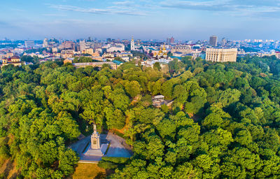 High angle view of trees and buildings against sky