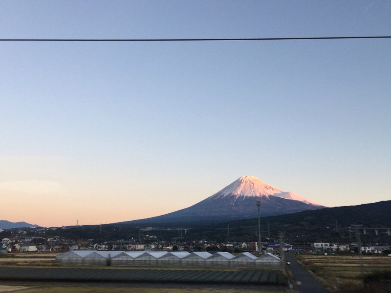 mountain, clear sky, mountain range, copy space, transportation, landscape, scenics, built structure, tranquility, tranquil scene, nature, beauty in nature, travel destinations, architecture, outdoors, travel, winter, road, sky, tourism