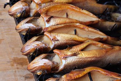 High angle view of fish arranged in row for sale at market