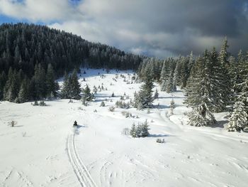 Scenic view of snow covered mountain against sky