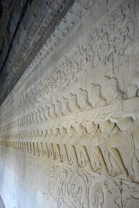 Low angle view of carving on wall