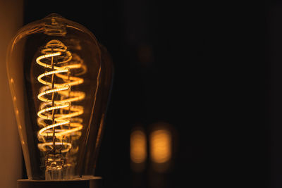 Close-up of illuminated light bulb