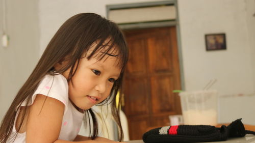 Portrait of cute girl at home