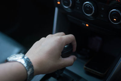 Close-up of hand holding car