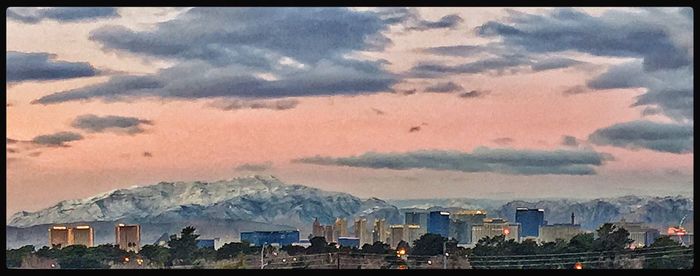 Scenic view of mountains against cloudy sky