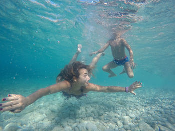 Woman swimming in swimming pool