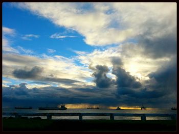 Scenic view of sea against cloudy sky