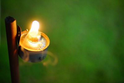 Close-up of burning candle