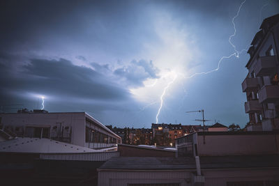 View of lightning over buildings in city