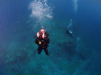 People swimming in sea