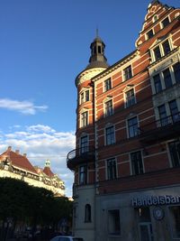 Low angle view of buildings against blue sky