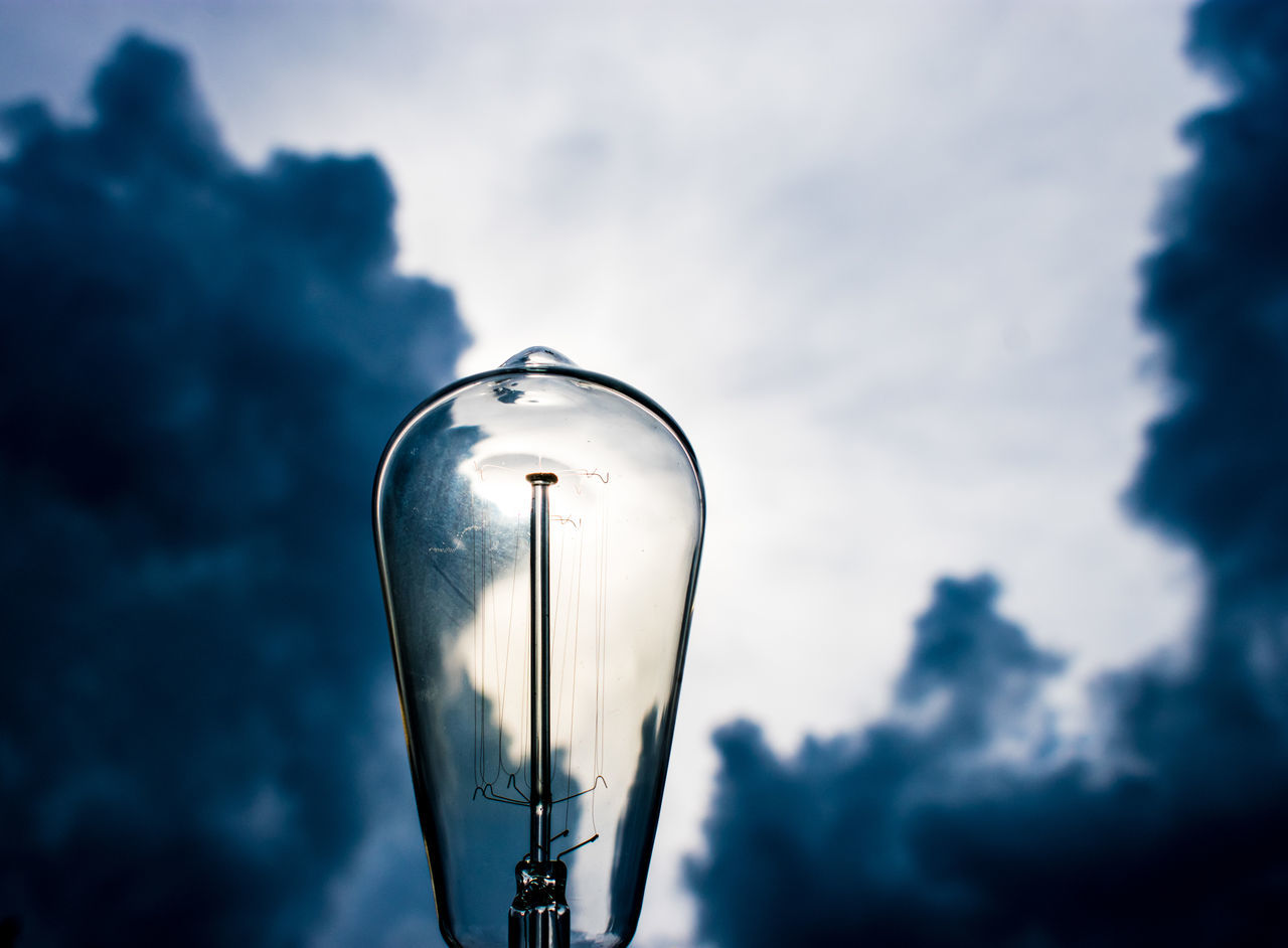 CLOSE-UP OF LIGHT BULB AGAINST SKY