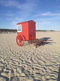 Lifeguard hut on beach against sky