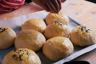 Close-up of person preparing food in kitchen