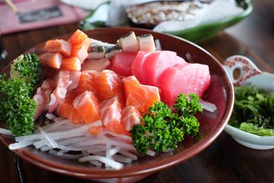 Close-up of chopped fish in bowl on table