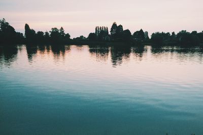 Scenic view of lake at sunset