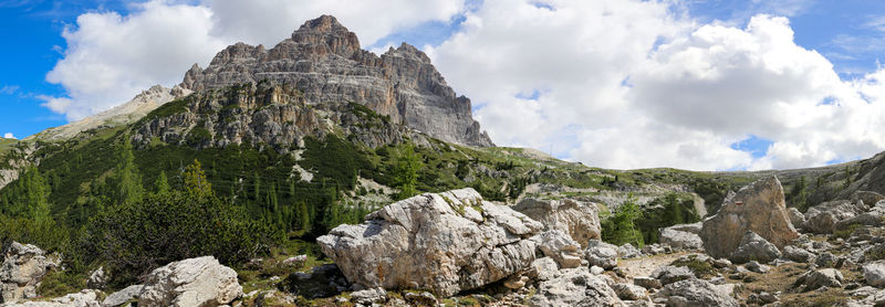 Low angle view of rocks on mountain against sky