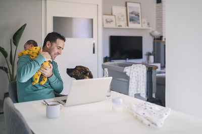 People sitting on table at home