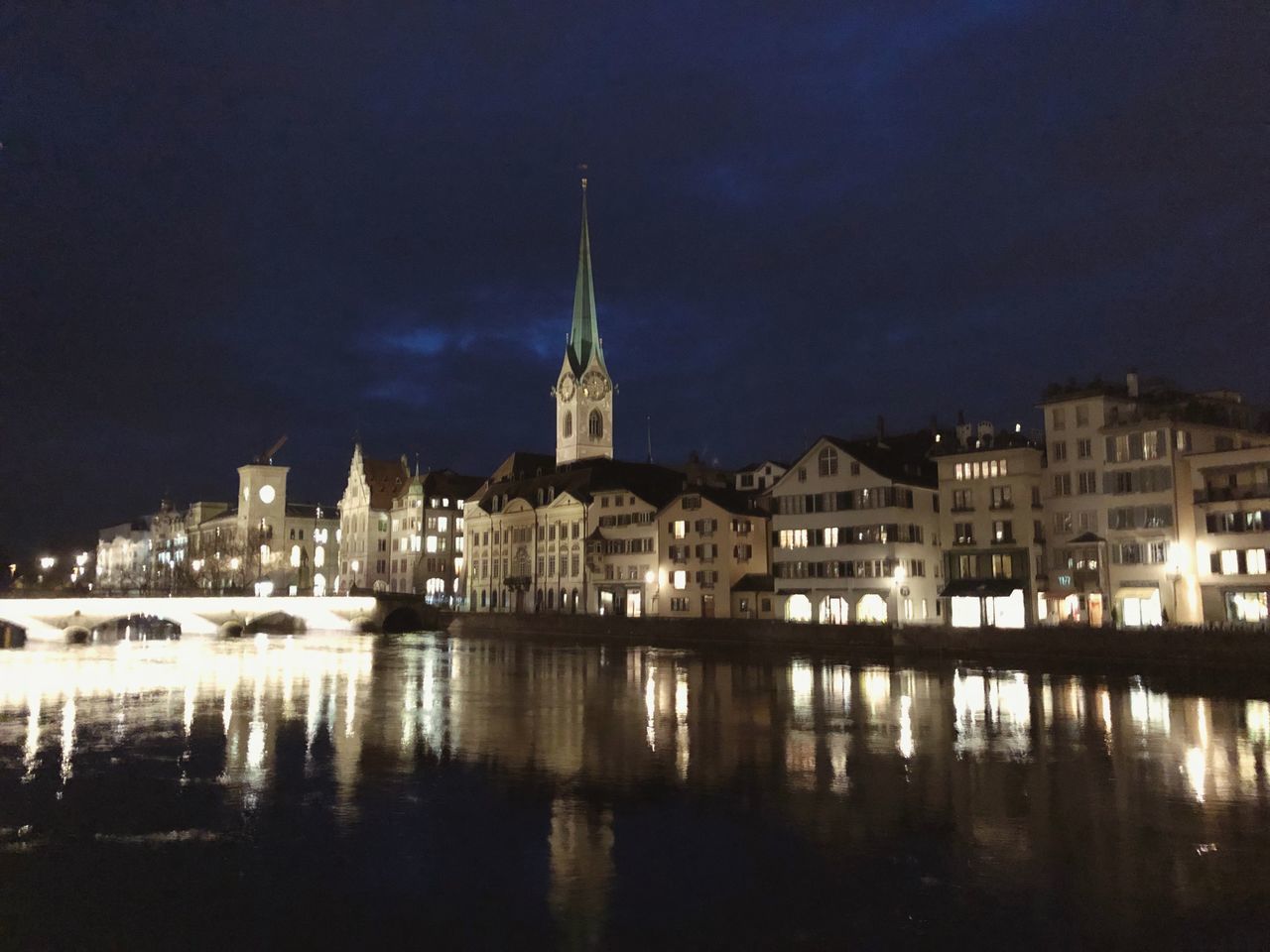 REFLECTION OF ILLUMINATED BUILDINGS IN WATER