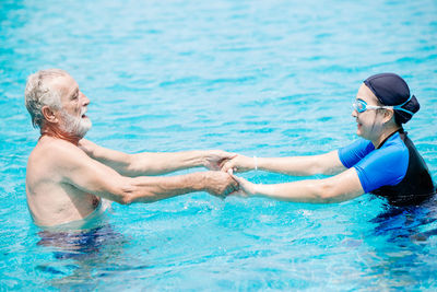 People enjoying in swimming pool