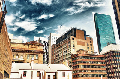 Low angle view of buildings in city against sky