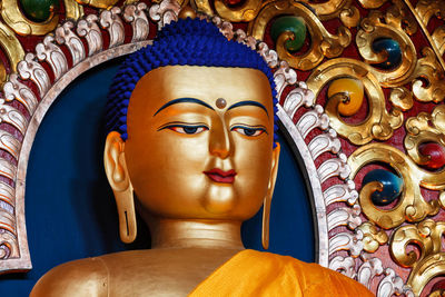 Close-up of buddha statue in temple