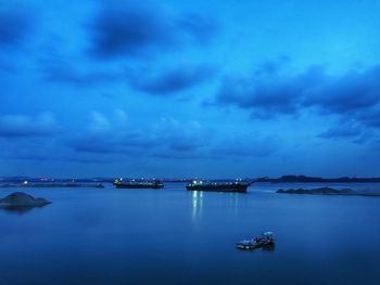 Scenic view of sea against sky at dusk