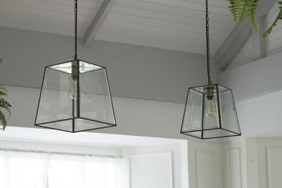Low angle view of pendant lights hanging from ceiling