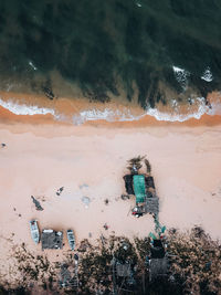 High angle view of man standing by sea